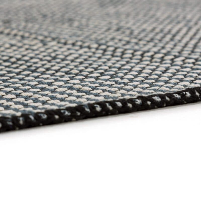 Schöner Wohnen Cottage Webteppich aus 100 % Baumwolle in der Farbe Schwarz.