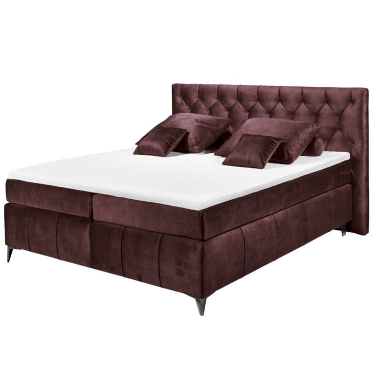 Trendstore Beth Boxspringbett in der Farbe Aubergine mit Dekokissen