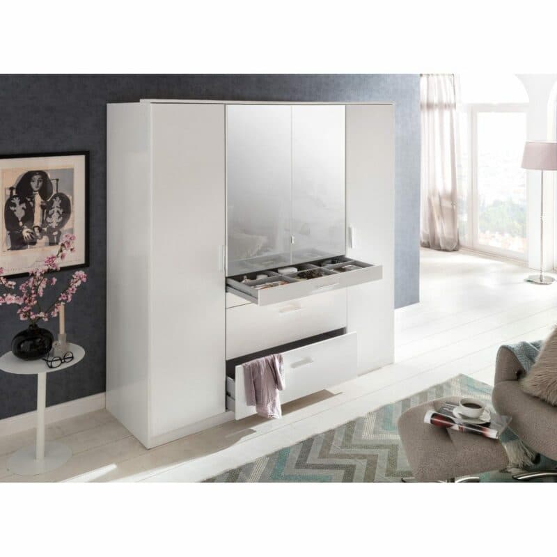 Wimex Aachen Drehtürenschrank in Weiß mit geöffneten Schubladen als Wohnbeispiel.