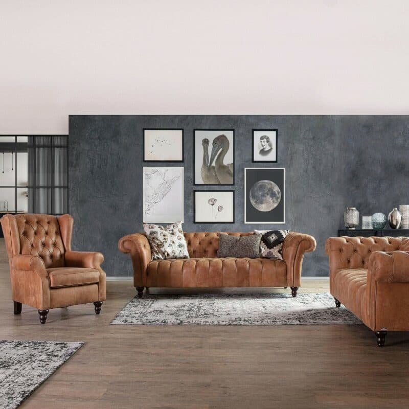 Trendstore Garvin Bigsofa mit Bezug in Anilinleder Braun und Antik-Füße Schwarz als Wohnbeispiel.