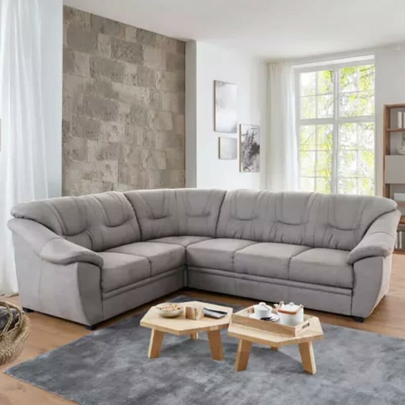 Polsteria Savona Ecksofa mit Bezug in Flachgewebe Euphoria 10 Grey und Ottomane links — Wohnbeispiel