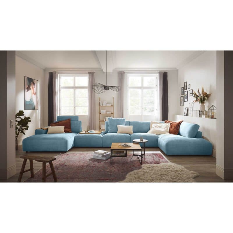 Musterring Lucia Wohnlandschaft Zwischenhocker Longchair links Bezug Cord light blue Wohnbeispiel