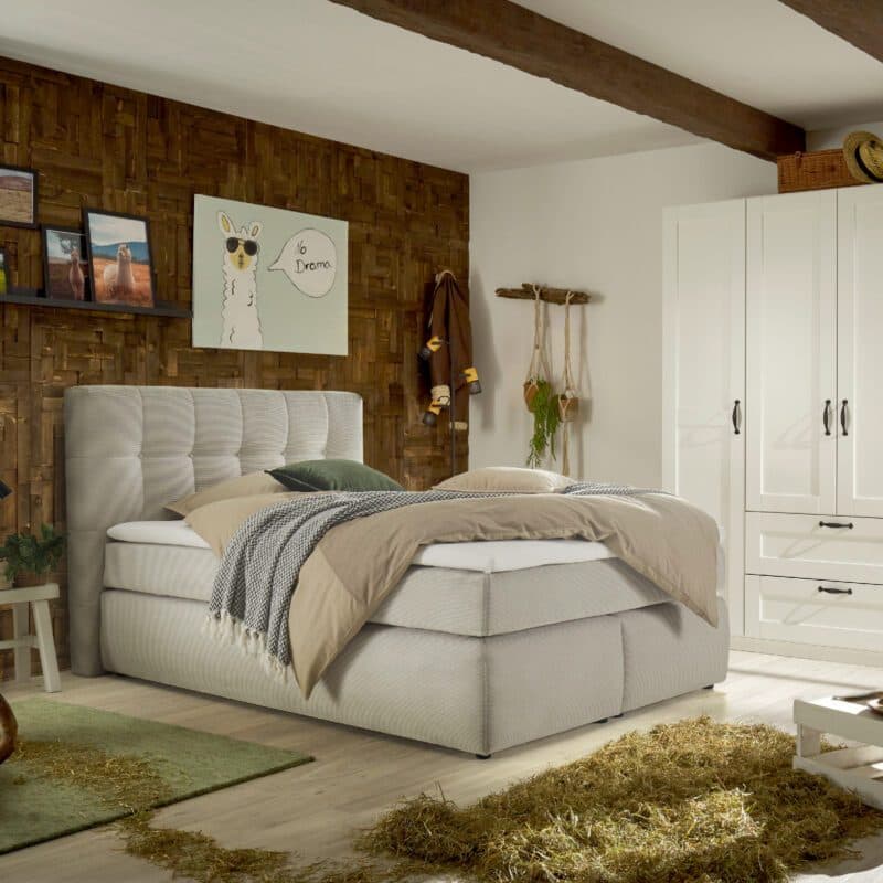 Trendstore Janah Boxspringbett in Bezug Cord beige, Wohnbeispiel.
