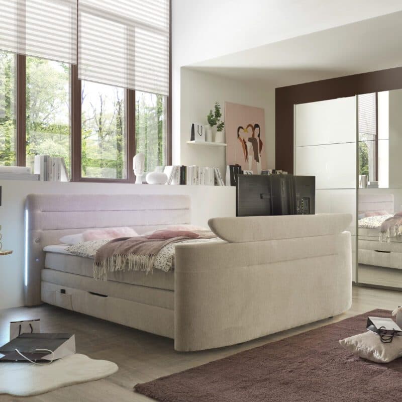 Trendstore Jella Mix Boxspringbett mit TV-Halterung im Fußteil.