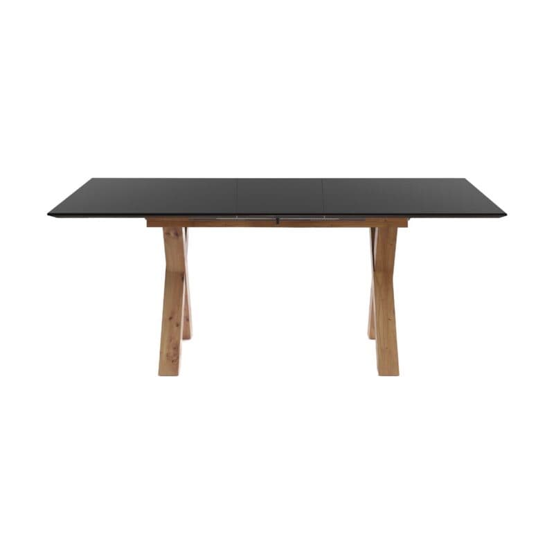 set one by Musterring New Atlanta Esstisch mit Platte in Dekor Vulkanschwarz und X-Gestell in Asteiche Artisan Nachbildung – Frontansicht mit Auszug