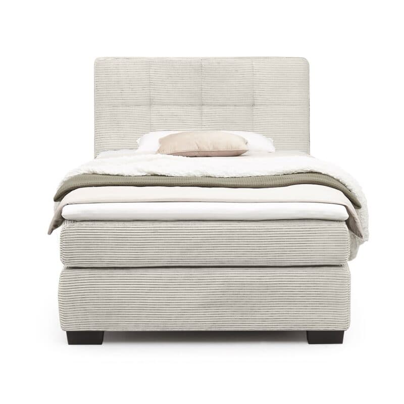Trendstore Jila Boxspringbett in Bezug Cord beige - Liegefläche 120 x 200 cm - Frontansicht Freisteller mit Deko