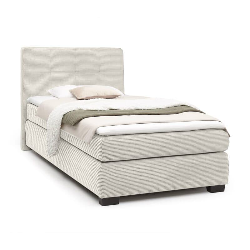Trendstore Jila Boxspringbett in Bezug Cord beige - Liegefläche 120 x 200 cm - Perspektivansicht Freisteller mit Deko