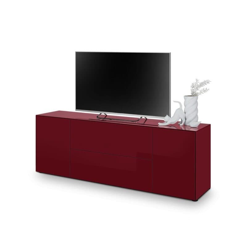 Trendstore Makoa Lowboard aus Glas bordeaux glanz, mit 2 Türen, 1 Schub und 1 Klappe, Variante A – Perspektivansicht